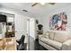 Stylish office area boasts a modern aesthetic with black marble floors and unique artwork at 441 Village Dr, Tarpon Springs, FL 34689