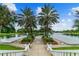 Picturesque waterfront view featuring a beautiful lake and inviting walkway at 441 Village Dr, Tarpon Springs, FL 34689