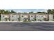 Modern townhomes boast neutral paint, individual garages, and manicured landscaping at 4427 Rachel Falls Dr, Tampa, FL 33610