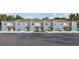 Charming townhomes featuring two-tone paint schemes, attached garages, and well-manicured landscaping at 4429 Rachel Falls Dr, Tampa, FL 33610
