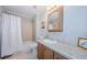 Neutral bathroom with shower and tub combo, framed mirror, and tiled sink and backsplash at 4844 Anchorage Cv, Port Richey, FL 34668