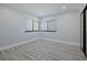 Bedroom featuring hardwood floors, a window, and a closet at 5020 Mill Pond Rd # 3158 & 3160, Wesley Chapel, FL 33543