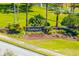 Beautiful 'Saddlebrook' community entrance sign surrounded by lush landscaping and greenery at 5020 Mill Pond Rd # 3158 & 3160, Wesley Chapel, FL 33543
