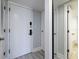 Hallway with access to bathroom and closet with mirror doors at 5020 Mill Pond Rd # 3158 & 3160, Wesley Chapel, FL 33543