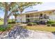 Inviting two-story building with well-maintained landscaping and convenient bike racks at 5020 Mill Pond Rd # 3158 & 3160, Wesley Chapel, FL 33543
