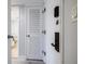 Hallway featuring a louvered closet door with access to the bathroom at 5020 Mill Pond Rd # 3158 & 3160, Wesley Chapel, FL 33543