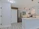 Updated kitchen featuring stainless steel appliances, white cabinets, and marble countertops at 5020 Mill Pond Rd # 3158 & 3160, Wesley Chapel, FL 33543