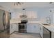 Renovated kitchen with stainless steel appliances and white marble countertops at 5020 Mill Pond Rd # 3158 & 3160, Wesley Chapel, FL 33543