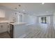Open concept living space featuring updated kitchen, modern flooring, and plenty of natural light at 5020 Mill Pond Rd # 3158 & 3160, Wesley Chapel, FL 33543