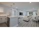 Open concept living space featuring updated kitchen, modern flooring, and plenty of natural light at 5020 Mill Pond Rd # 3158 & 3160, Wesley Chapel, FL 33543