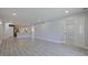 Spacious living area features hardwood flooring, recessed lighting, and easy access to the kitchen at 5020 Mill Pond Rd # 3158 & 3160, Wesley Chapel, FL 33543