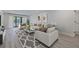 Bright living room with a large window, stylish furniture, elegant rug, and modern decor at 5020 Mill Pond Rd # 3158 & 3160, Wesley Chapel, FL 33543