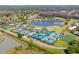 Aerial view of multiple tennis courts and a sports field within this active community at 5020 Mill Pond Rd # 3158 & 3160, Wesley Chapel, FL 33543