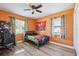 Youthful bedroom featuring bright colors, natural light, and laminate floors at 506 Avocado Dr, Seffner, FL 33584