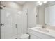 Bathroom featuring a tiled shower, sink, and vanity with white cabinets at 5335 Wolf Creek Dr, Apollo Beach, FL 33572