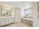 Modern bathroom features a soaking tub, sleek vanity, and contemporary fixtures, creating a spa-like experience at 5335 Wolf Creek Dr, Apollo Beach, FL 33572