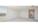 A light-filled bedroom with carpet and a view of the exterior, offering a blank canvas for customization at 5335 Wolf Creek Dr, Apollo Beach, FL 33572