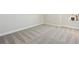 Bright, spacious bedroom showcasing neutral walls and plush carpeting, ready for customization and furnishings at 5335 Wolf Creek Dr, Apollo Beach, FL 33572