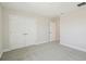 Large bedroom features carpeted flooring and double closet at 5335 Wolf Creek Dr, Apollo Beach, FL 33572