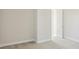 A bedroom showing neutral walls and carpeted floors at 5335 Wolf Creek Dr, Apollo Beach, FL 33572