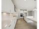 Modern kitchen with sleek appliances, white cabinetry, and a large island at 5335 Wolf Creek Dr, Apollo Beach, FL 33572