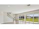 Bright living area featuring large sliding glass doors with backyard views and a staircase at 5335 Wolf Creek Dr, Apollo Beach, FL 33572