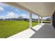 Covered patio with view of grassy backyard at 5335 Wolf Creek Dr, Apollo Beach, FL 33572