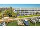 Exterior of the waterfront condo featuring private docks and well-manicured lawns at 545 Pinellas Bayway S # 109, St Petersburg, FL 33715