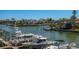 Water view features boats docked along a canal with waterfront homes in the background at 545 Pinellas Bayway S # 109, St Petersburg, FL 33715