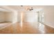 Neutral living room with lots of sunlight, tile floors, and ceiling fan at 6209 Flamingo Dr, Apollo Beach, FL 33572