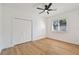 Simple bedroom design with wood floors, a window, and large closet at 6314 Soratrace St, Lithia, FL 33547