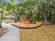 Shady playground with climbing structures, slides, and swings, perfect for outdoor Gathering fun at 6314 Soratrace St, Lithia, FL 33547