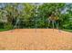 Well maintained community playground with wood chip base and shade trees at 6314 Soratrace St, Lithia, FL 33547