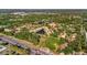 Aerial shot of community with lush greenery, mature trees, and winding roads at 6843 Se Dartmouth Hill St, Riverview, FL 33578