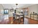 Inviting dining area with hardwood floors, natural light, and adjacent open-concept kitchen at 6843 Se Dartmouth Hill St, Riverview, FL 33578