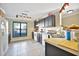 Well-lit kitchen features stainless steel sink, white appliances, and dark cabinets at 6843 Se Dartmouth Hill St, Riverview, FL 33578