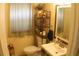 Bright bathroom with a large mirror, ample lighting, and a shelf displaying decorative items at 716 Burlwood St, Brandon, FL 33511