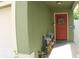 Welcoming front entrance with a decorated door and colorful potted plants at 716 Burlwood St, Brandon, FL 33511