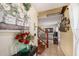 Inviting entryway featuring tile floors, wood staircase, and charming decor, creating a warm and welcoming ambiance at 716 Burlwood St, Brandon, FL 33511