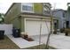 Side view of a home with a two-car garage and a well-kept lawn at 716 Burlwood St, Brandon, FL 33511