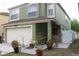 Charming two-story home with a well-maintained lawn and a two car garage at 716 Burlwood St, Brandon, FL 33511