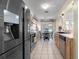 Modern kitchen with stainless steel appliances, wooden cabinets, and an eat-in area at 716 Burlwood St, Brandon, FL 33511