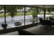 Relaxing screened patio overlooking a serene pond with a white picket fence at 716 Burlwood St, Brandon, FL 33511