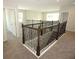 Upstairs hallway boasts decorative railing and access to multiple rooms at 740 Steel Dr, Apollo Beach, FL 33572