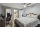 Spacious bedroom features a ceiling fan and is attached to bathroom and closet at 8130 Braddock Cir # 3, Port Richey, FL 34668