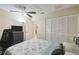 Spacious bedroom featuring a ceiling fan and large closet at 8130 Braddock Cir # 3, Port Richey, FL 34668