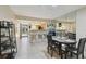 Dining and living area showcasing the open layout and seamless flow between spaces at 8130 Braddock Cir # 3, Port Richey, FL 34668
