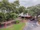 Charming exterior of the Timber Oaks Clubhouse featuring well-maintained landscaping and a welcoming entrance at 8130 Braddock Cir # 3, Port Richey, FL 34668