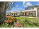 Charming single-story home with lush landscaping and a welcoming front yard at 8130 Braddock Cir # 3, Port Richey, FL 34668