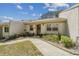Charming single-story home featuring a well-maintained front lawn and inviting curb appeal at 8130 Braddock Cir # 3, Port Richey, FL 34668